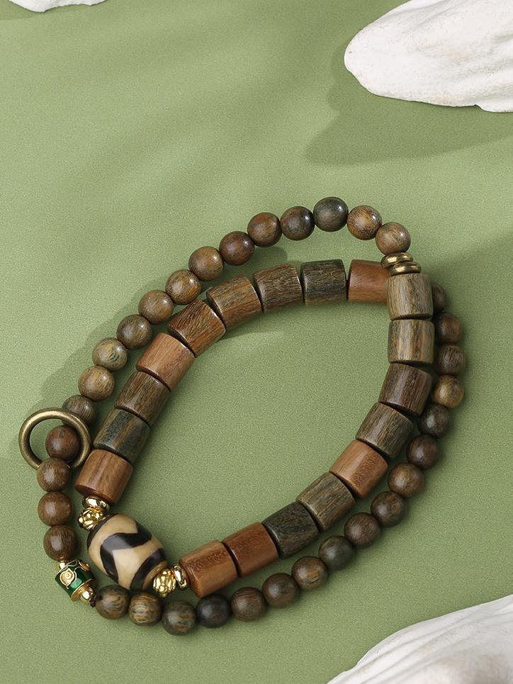 Multi-circle agate sandalwood mala with handmade alloy decorations. This Tibetan Buddhist jewelry culture piece showcases traditional craftsmanship.