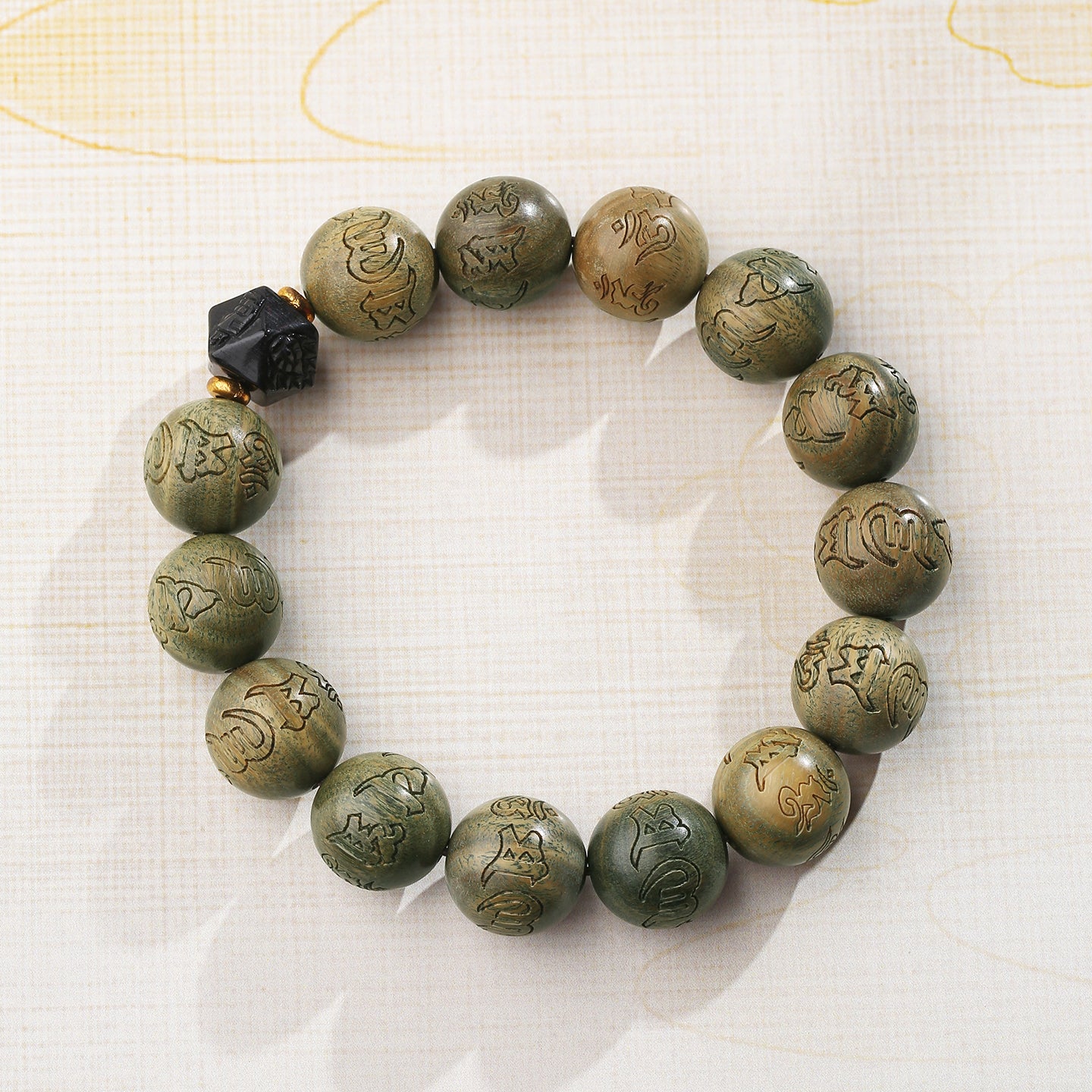 Serene sandalwood meditation strand featuring pure handcrafted green sandalwood beads and obsidian accents. This Tibetan Buddhist jewelry art piece supports mindful practice and spiritual protection through authentic traditions.