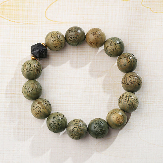 Serene sandalwood meditation strand featuring pure handcrafted green sandalwood beads and obsidian accents. This Tibetan Buddhist jewelry art piece supports mindful practice and spiritual protection through authentic traditions.