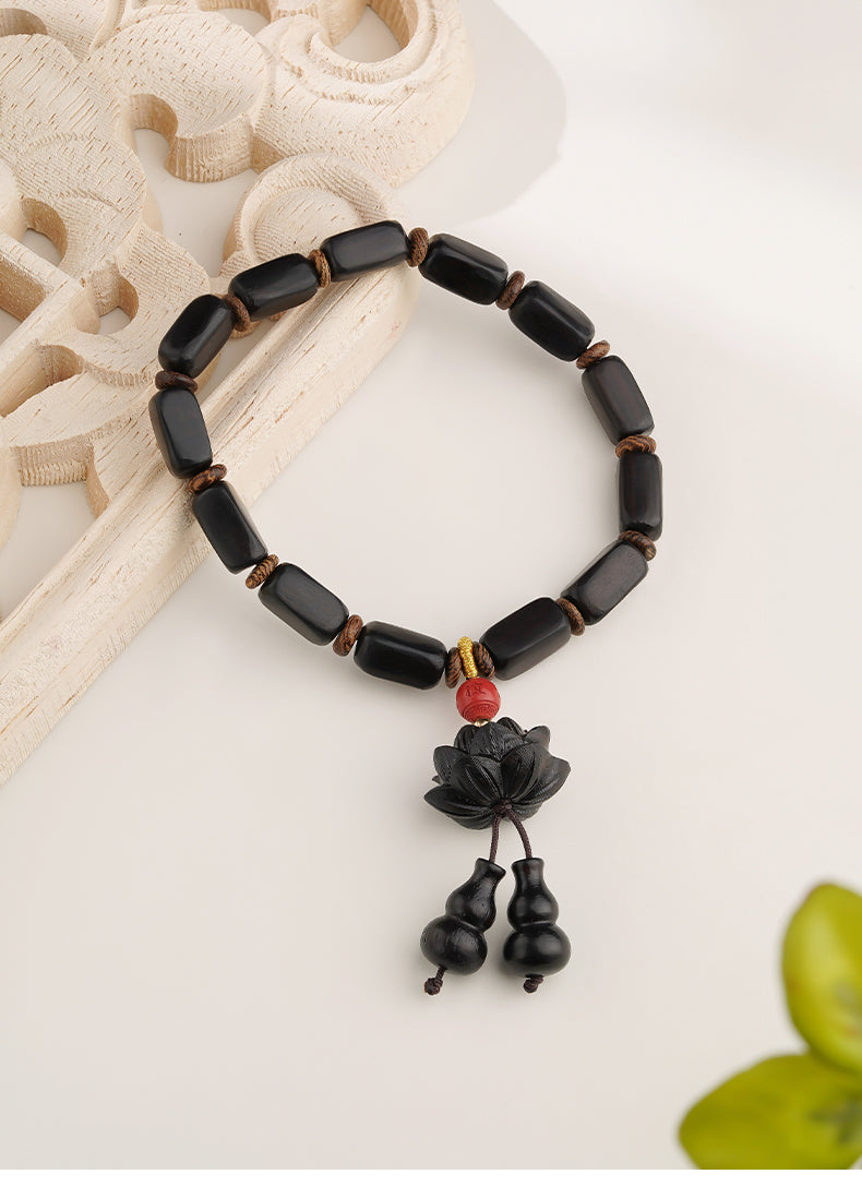 Exquisite hand-painted ebony lotus bead bracelet, merging natural elements with traditional art, embodying the essence of Tibetan Buddhist jewelry culture.
