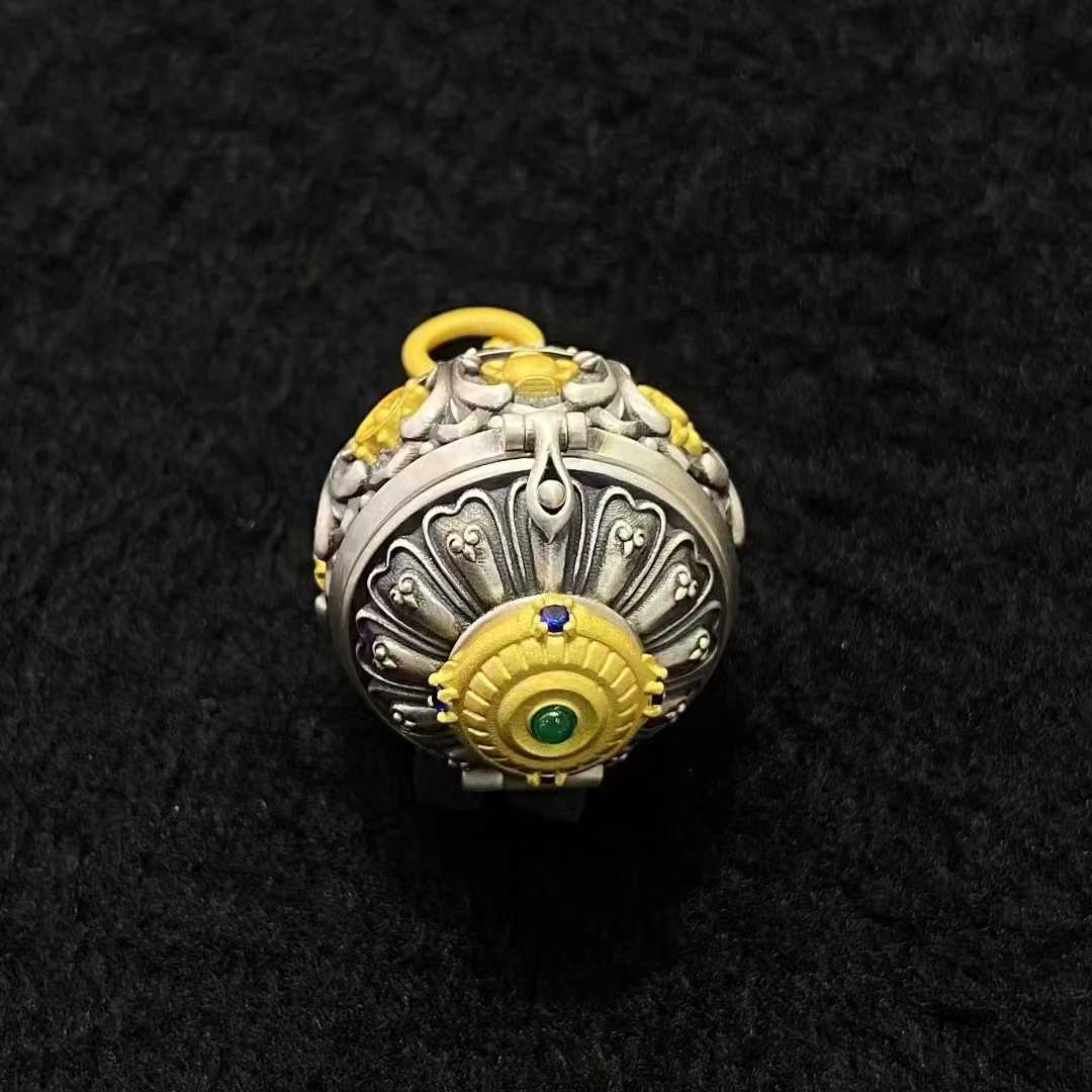 An artisanal piece from Tibetan Buddhist jewelry culture, this sterling silver pendant is dedicated to the Eight Treasures, key symbols in Buddhist symbolism for protection and wisdom.