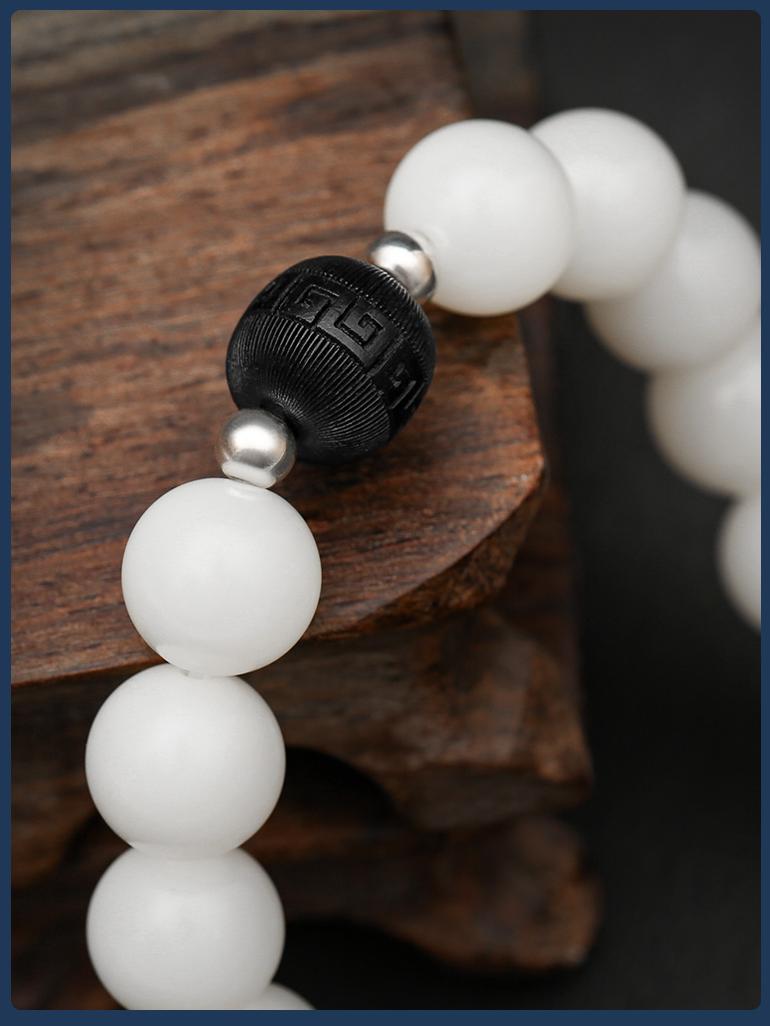 Pure Bodhi Prayer Beads showcasing artisan wood carving on 15 mala beads. This jewelry culture represents authentic Tibetan Buddhist spiritual traditions.