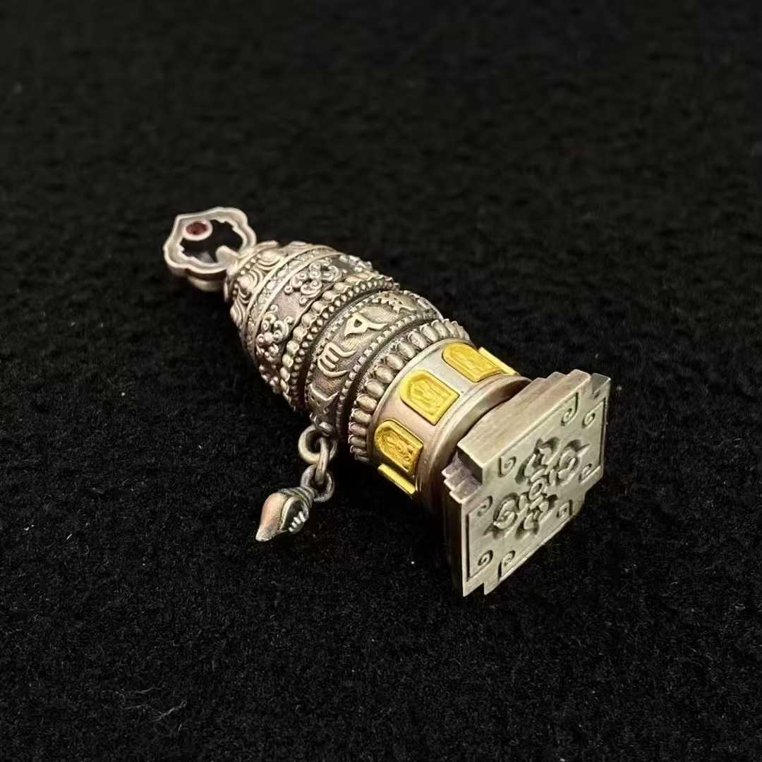  Meticulously inlaid mantra cylinder pendant in S925 silver, displaying the sacred Om Mani symbol - a perfect fusion of Tibetan Buddhist jewelry art and spiritual practice.