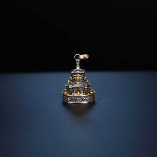 This meticulously inlaid Tibetan mandala pendant in 925 silver embodies the essence of jewelry art, representing the path to enlightenment through traditional Buddhist sacred art.