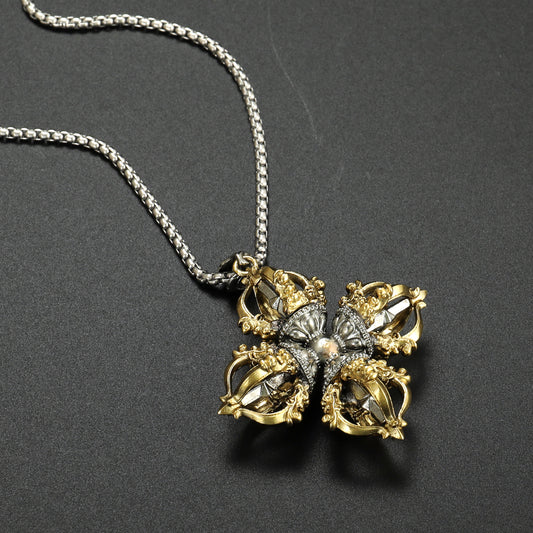 Handcrafted Tibetan Buddhist Capricorn Cross Vajra pendant made from brass and white copper, showcasing intricate jewelry art with spiritual symbolism.