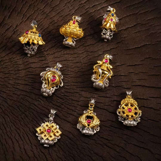 Handcrafted silver Eight Auspicious Symbols pendant inspired by Tibetan Buddhist jewelry culture, sacred jewelry art for protection and blessings.