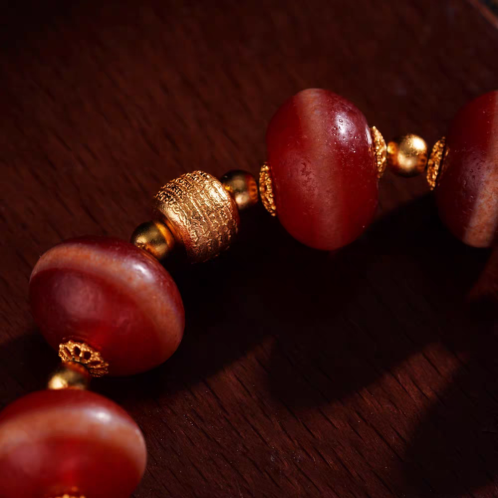 Handcrafted Tibetan Buddhist red coral Medicine Buddha bead bracelet, combining spiritual protection, positive energy, and traditional jewelry art