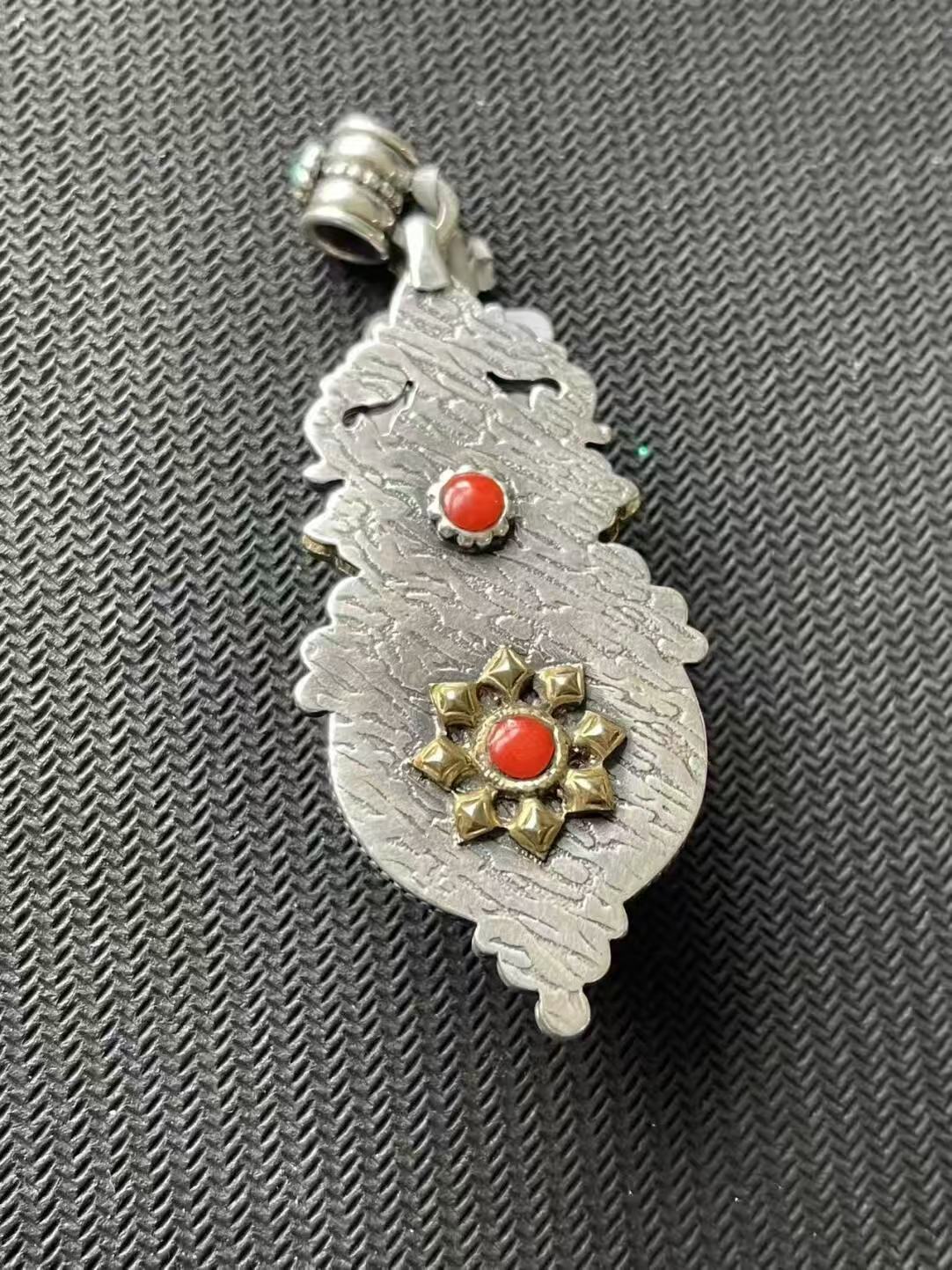 Pure hand-painted blue pendant, embodying Tibetan Buddhist artistry with intricate detailing, symbolizing spiritual growth and inner peace. A timeless addition to any collection.