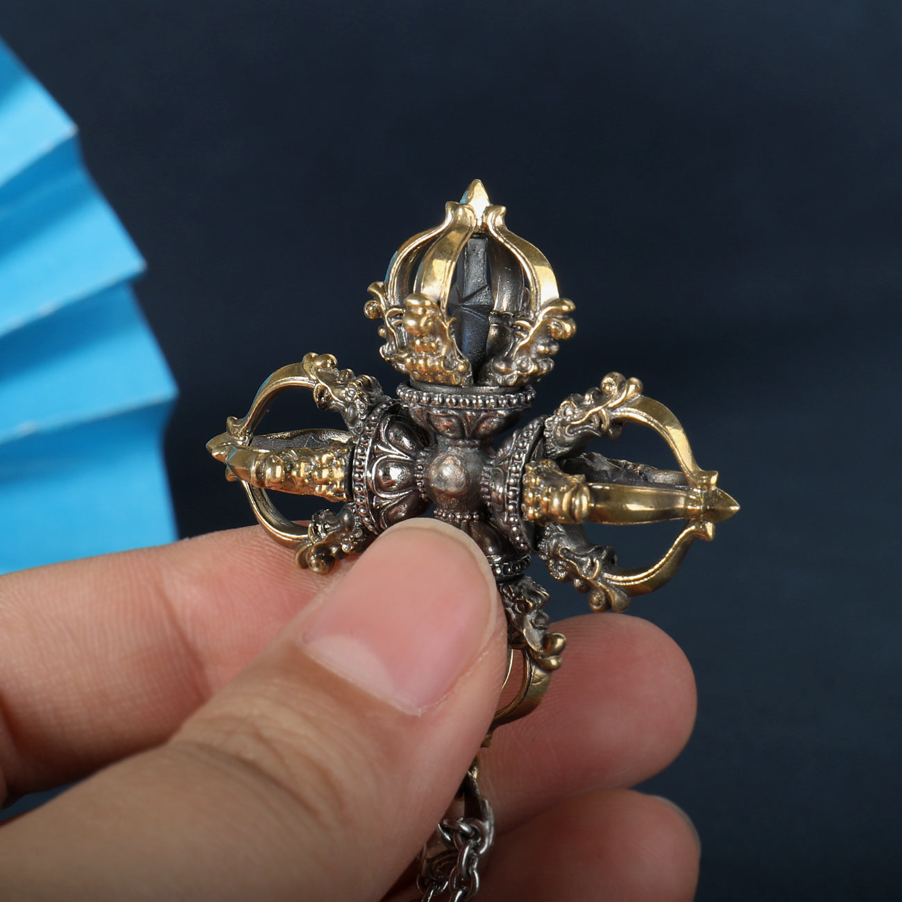 Tibetan Buddhist Capricorn Cross Vajra pendant in brass and white copper, hand-painted with spiritual artistry, reflecting strength and wisdom.