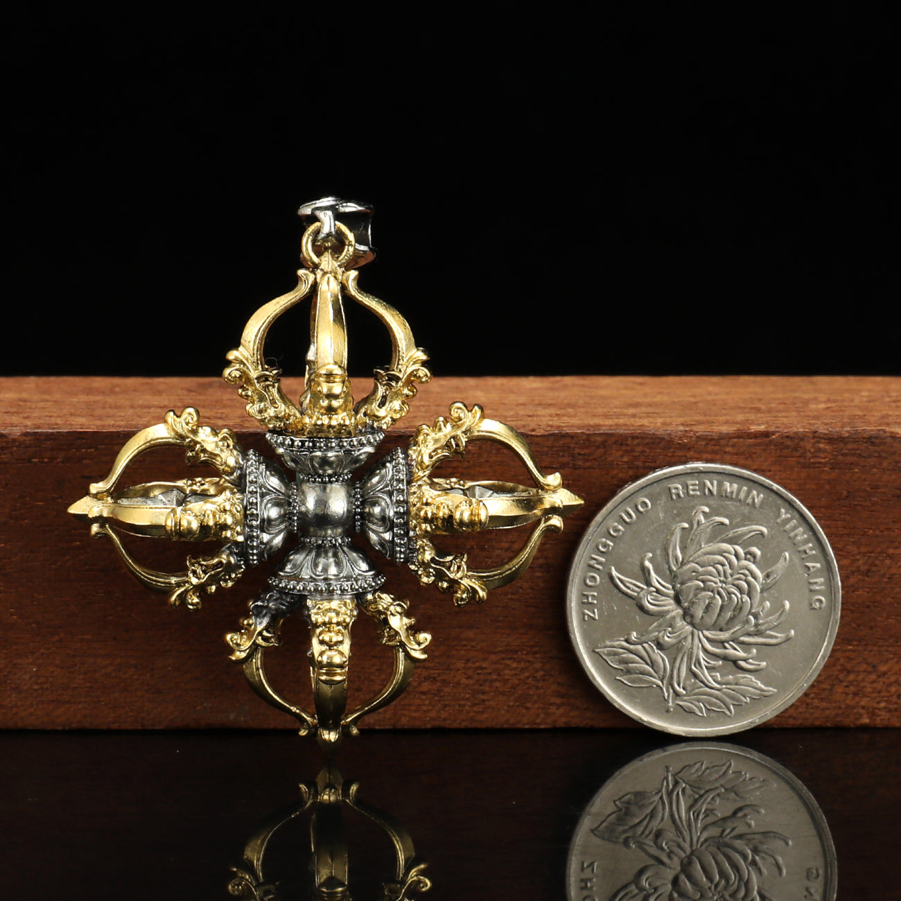 Handcrafted Capricorn Cross Vajra pendant in brass and white copper, designed with Tibetan Buddhist art, offering spiritual symbolism and elegance