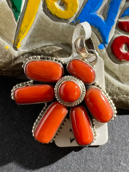 Handcrafted red pendant inspired by Tibetan Buddhist art. This classic design symbolizes strength, protection, and spiritual harmony, perfect for meditation or daily wear.