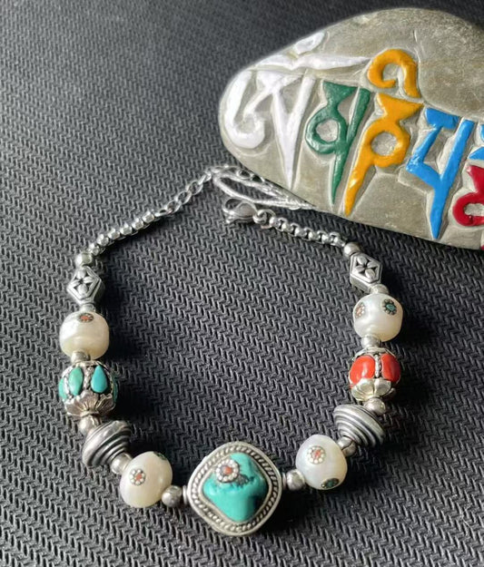 Exquisite handcrafted bracelet featuring colorful multi-treasure beads, reflecting Tibetan Buddhist jewelry culture and art, symbolizing vitality and abundance.