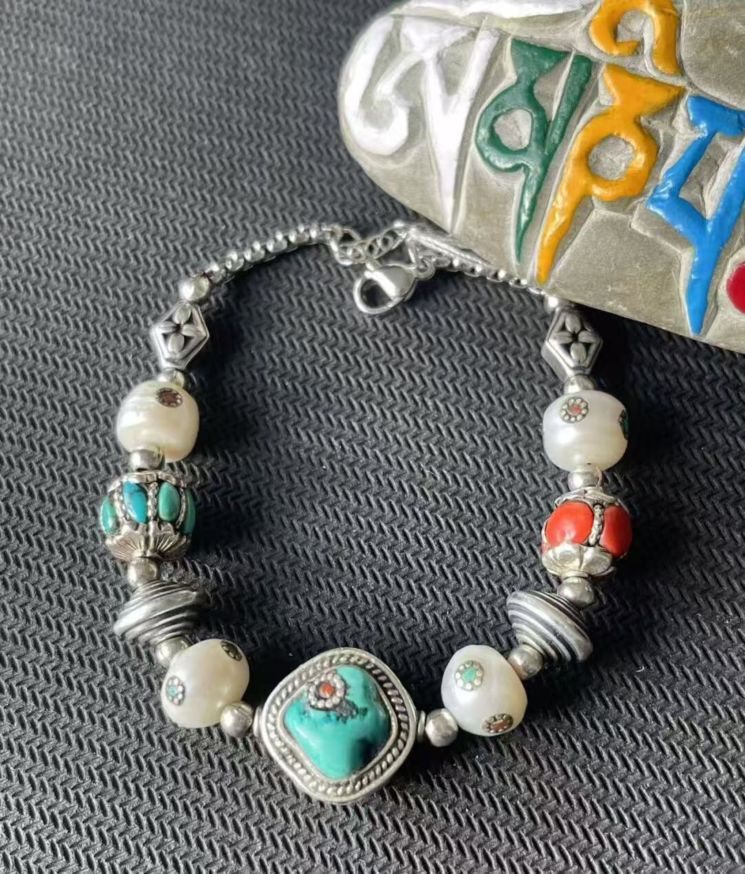 Colorful multi-treasure bracelet, handcrafted with care, reflecting Tibetan Buddhist culture and jewelry art, symbolizing joy, abundance, and protection.