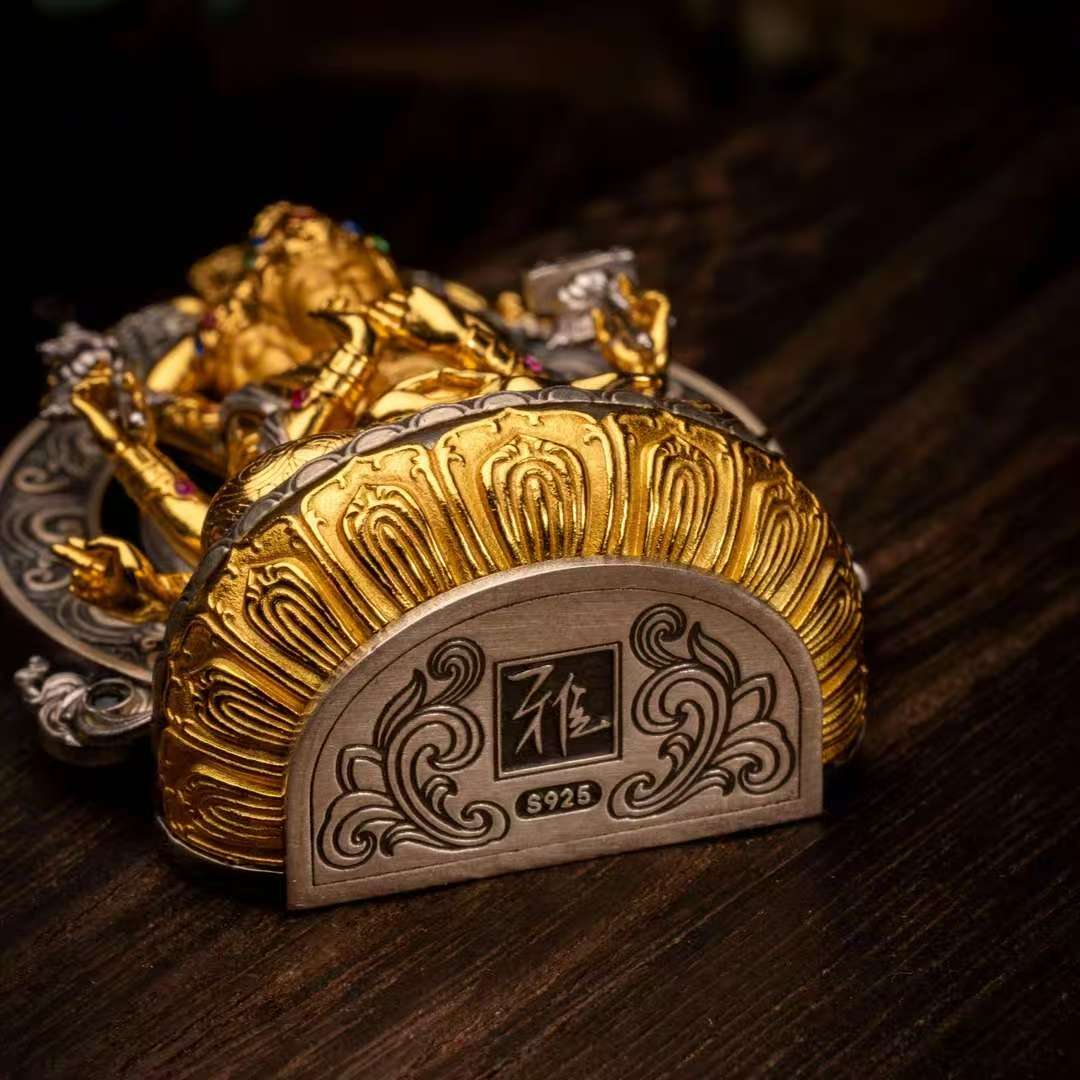 Handmade esoteric Twelve-Armed Manjushri pendant from Tibetan Buddhist jewelry culture, traditional jewelry art for spiritual practice and protection.