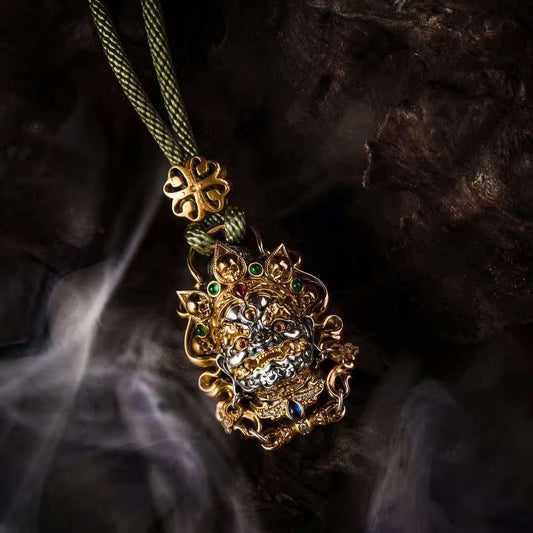 Handmade Mahakala guardian silver pendant from Tibetan Buddhist jewelry culture, spiritual jewelry art for protection and strength.