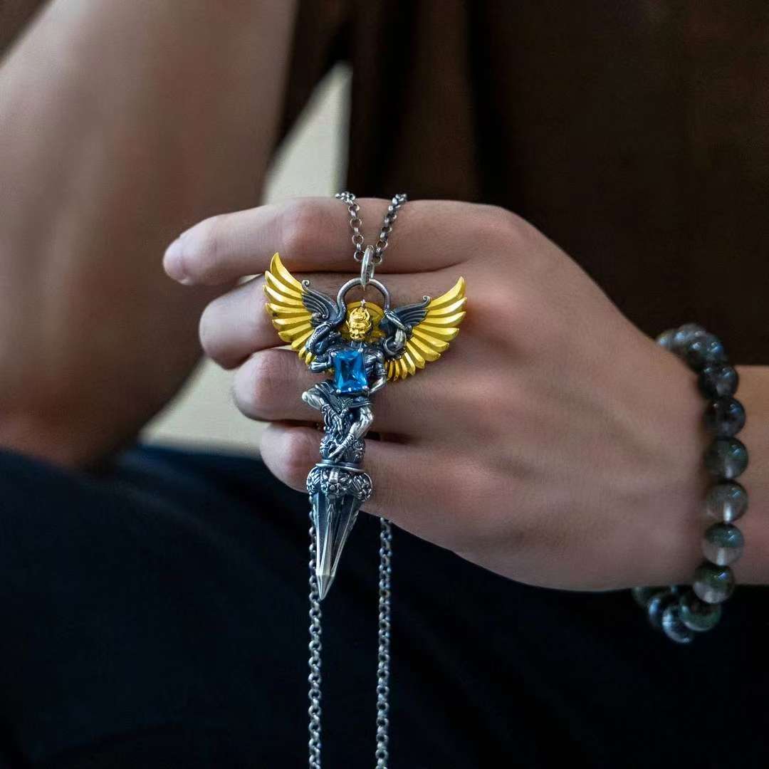 Sacred four-armed Garuda silver pendant representing Tibetan Buddhist jewelry culture and protective energy.