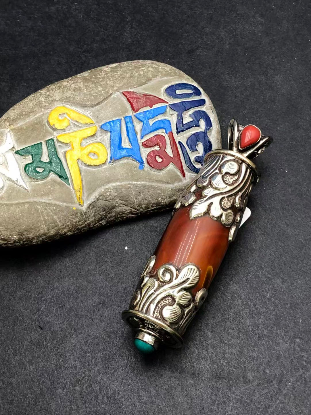 Hand-painted red agate pendant inspired by Tibetan Buddhist culture. A powerful symbol of spiritual clarity, healing, and personal protection.