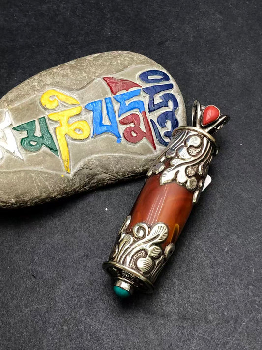 Hand-painted red agate pendant inspired by Tibetan Buddhist culture. A powerful symbol of spiritual clarity, healing, and personal protection.