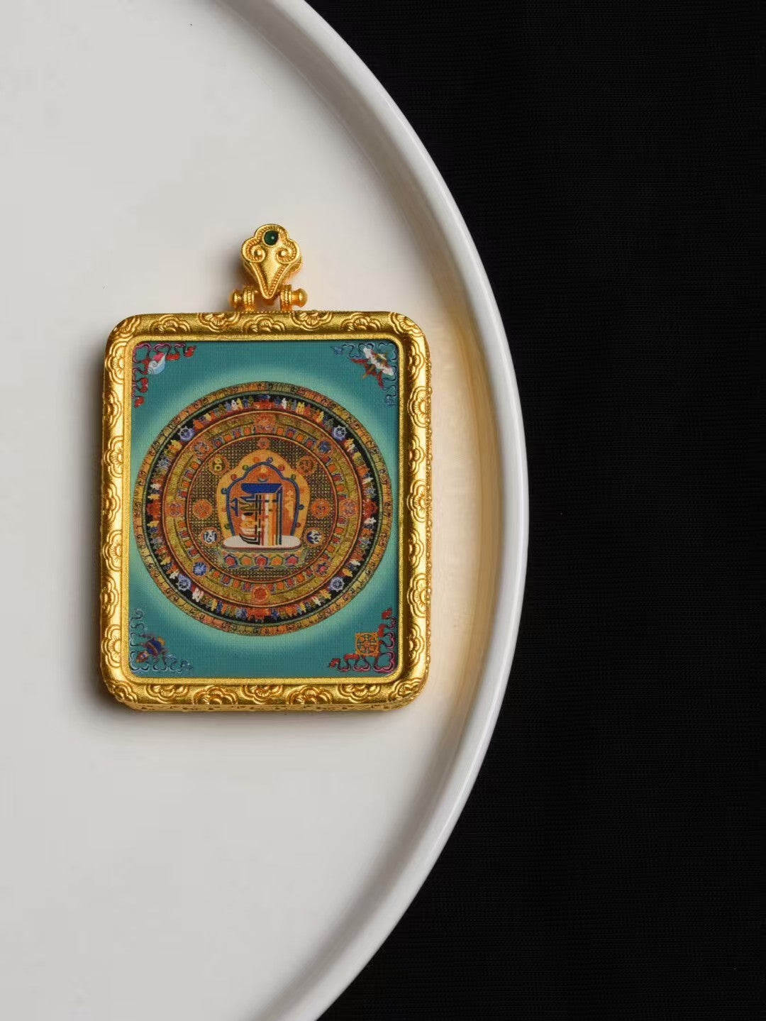 Handmade Yellow Jambhala thangka pendant from Tibetan Buddhist jewelry culture, sacred jewelry art for wealth attraction and protection.