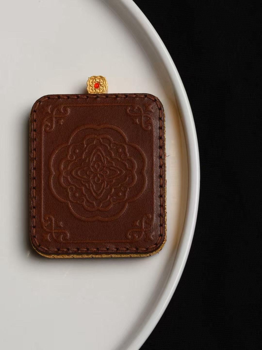 Handmade Yellow Jambhala Buddhist pendant from Tibetan Buddhist jewelry culture, meaningful jewelry art for prosperity and protection.