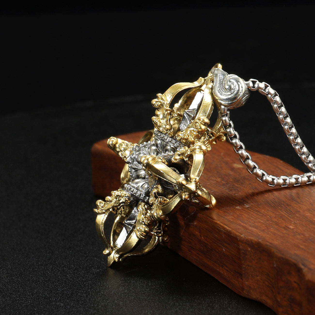 Pure hand-painted Capricorn Cross Vajra pendant made from brass and white copper, representing the spiritual journey of wisdom and power in Tibetan Buddhism.