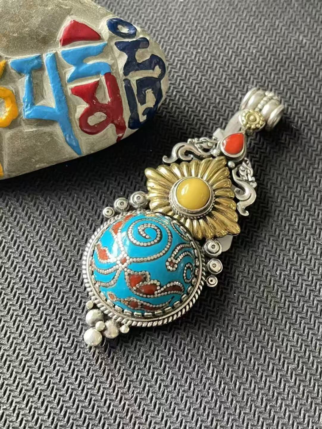 Handcrafted blue round pendant in a palace-style, reflecting Tibetan Buddhist artistry. Perfect for those seeking balance and beauty in their spiritual and daily life.