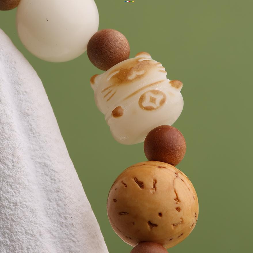 Beautiful hand-painted mala beads made with agate and Bodhi seeds, embodying the spiritual essence of Tibetan Buddhist jewelry art for meditation and daily wear.