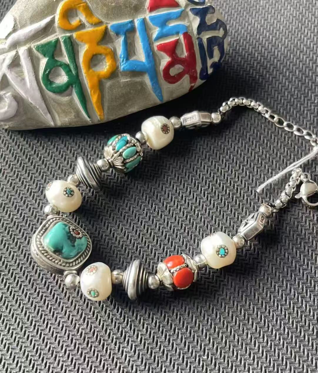 Handcrafted dazzling bracelet featuring multi-treasure beads, blending Tibetan Buddhist culture with modern jewelry art, perfect for those seeking a spiritual connection.
