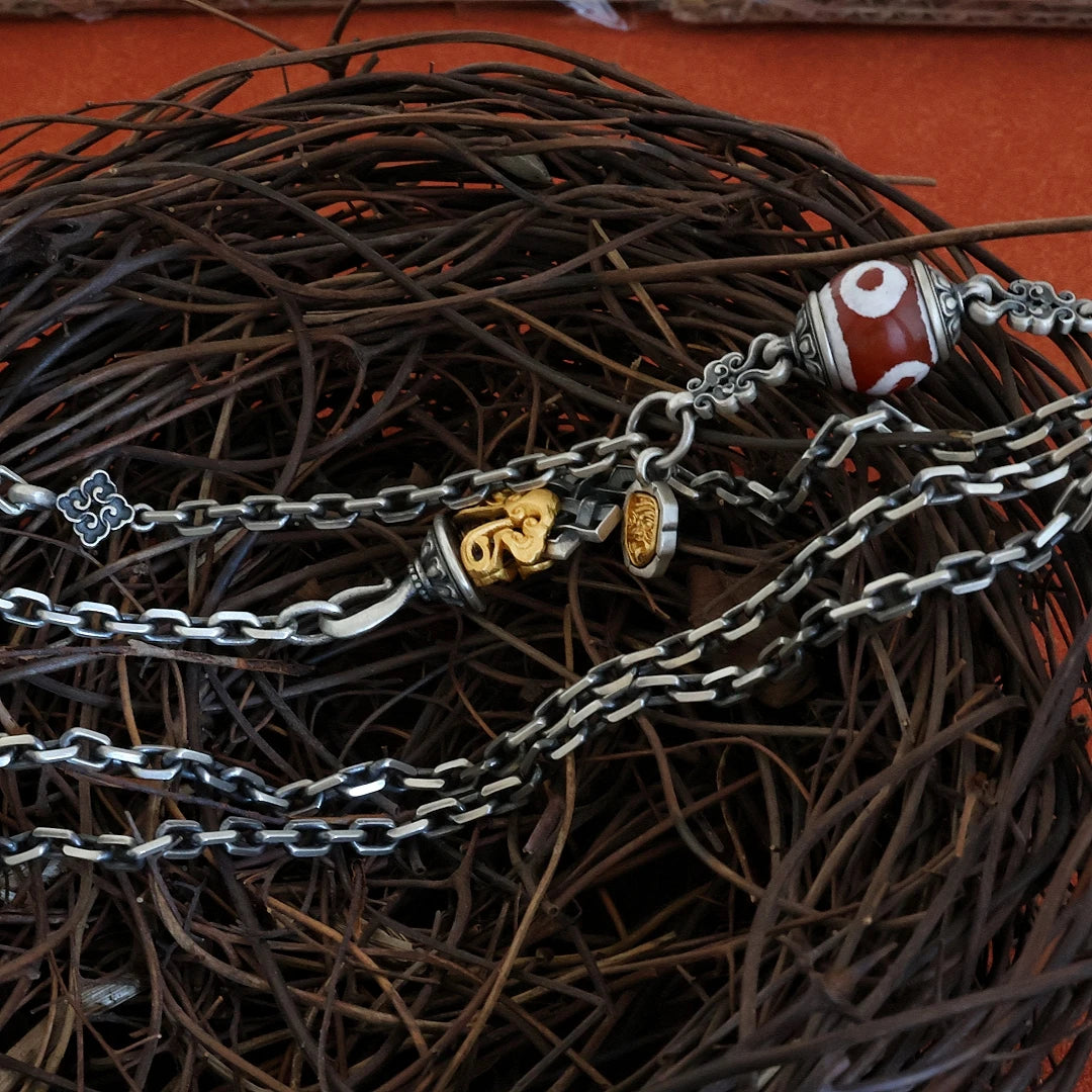 Minimalist Tibetan Buddhist inspired long necklace, creative daily wear pendant reflecting traditional jewelry art.