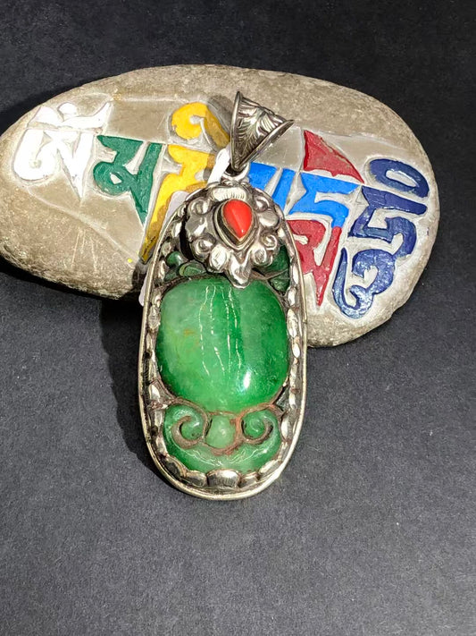 Pure hand-painted old jade pendant, reflecting Tibetan Buddhist cultural artistry. A spiritual and timeless piece symbolizing peace, wisdom, and healing.