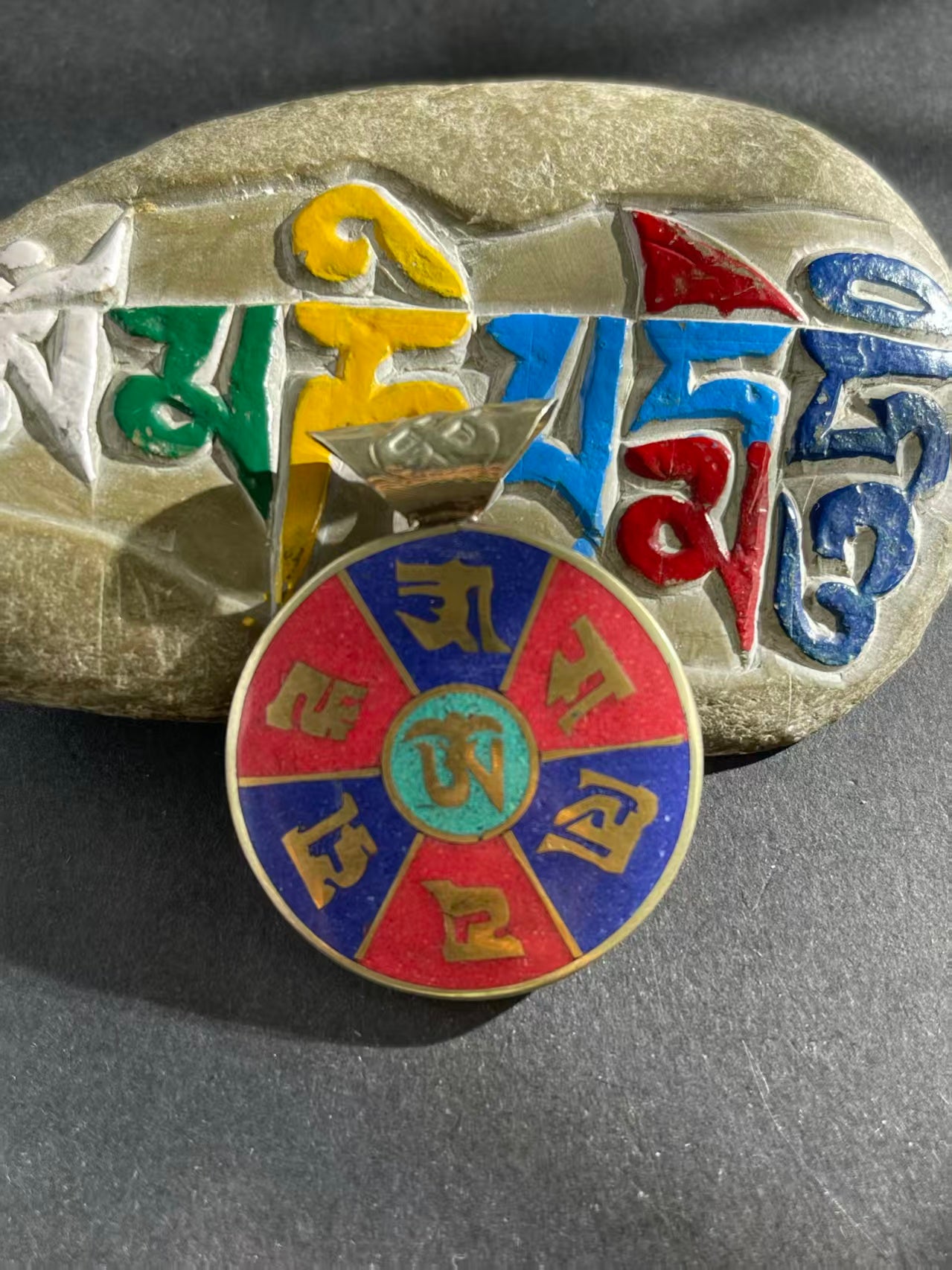 Handcrafted patch pendant with Tibetan Buddhist influences, showcasing intricate design and spiritual significance. A unique piece symbolizing protection and balance.