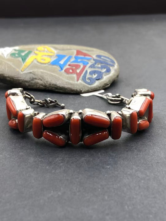Handmade red plastic bracelet, combining Tibetan Buddhist jewelry culture with pure handcraft and vibrant color, perfect for adding a spiritual touch to your style.