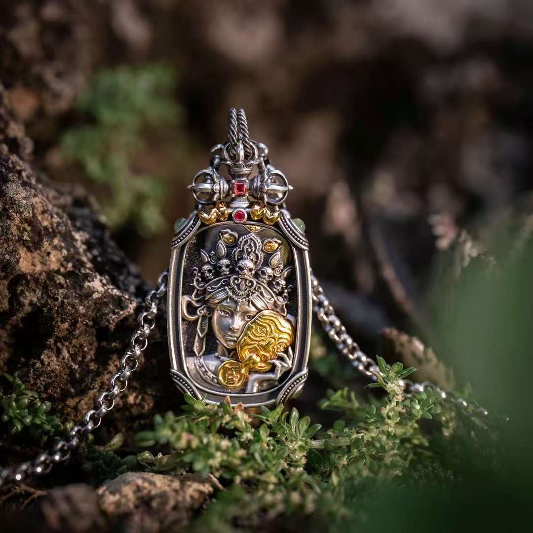 Hand-painted silver Ten Auspicious Symbols pendant inspired by Tibetan Buddhist jewelry culture, symbolizing harmony, wisdom, and protection.