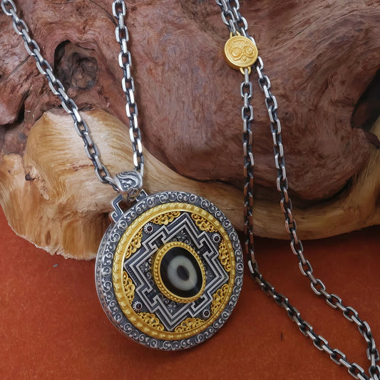 Handcrafted silver mandala pendant inspired by Tibetan Buddhist jewelry culture, symbolizing fortune flow and spiritual balance.