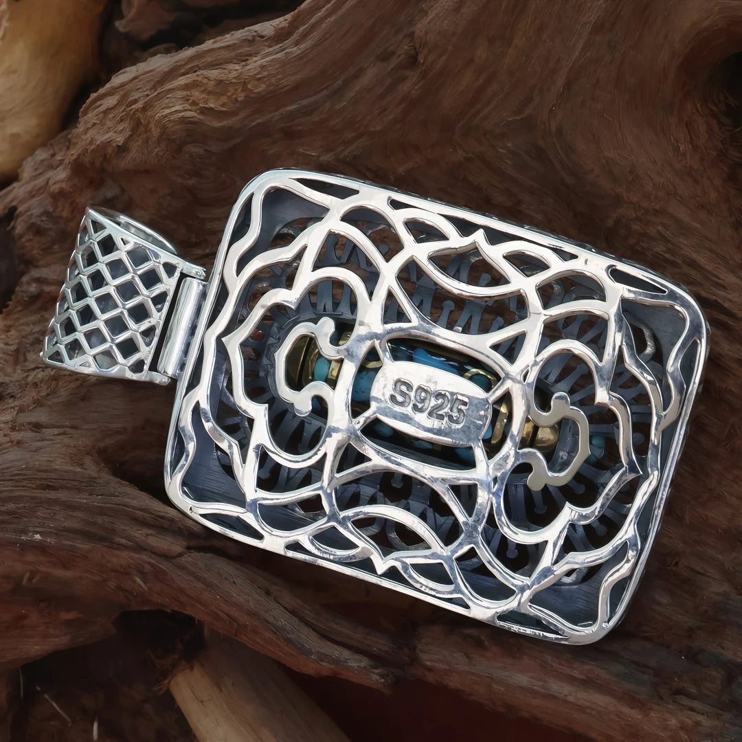 Handcrafted silver nine-eye Taotie square pendant inspired by Tibetan Buddhist jewelry culture, symbolizing protection and fortune.