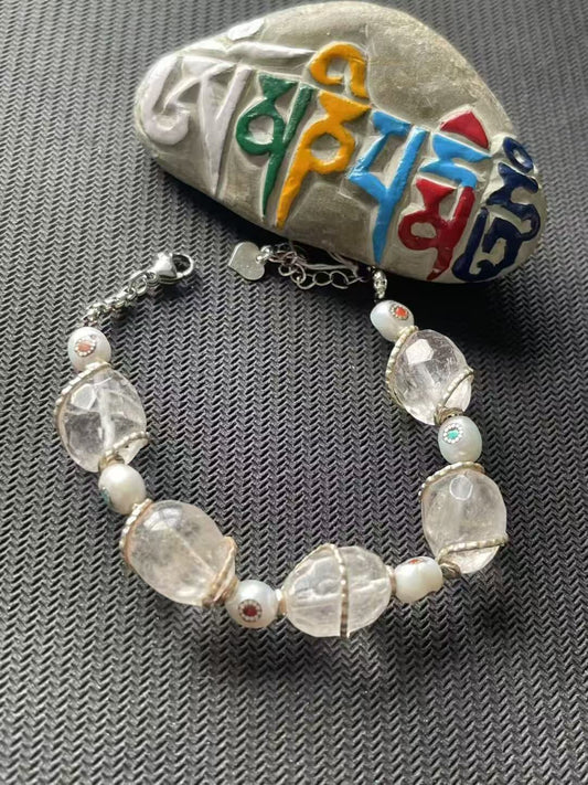 Alt Text: Handcrafted white crystal multi-treasure bracelet inspired by Tibetan Buddhist jewelry culture. Elegant design with spiritual significance for prosperity and protection.