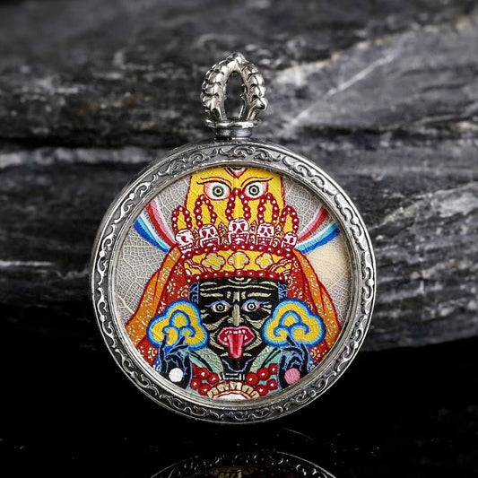 Handcrafted Zaki Lam Yellow Wealth Buddha Thangka pendant necklace with Blue Bodhi Leaf hand-painting, symbolizing prosperity and spiritual enlightenment