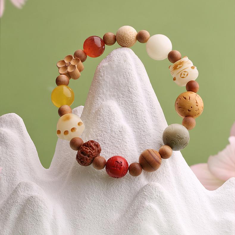A handmade bracelet combining cinnabar, Bodhi seeds, and glass beads, symbolizing protection and spiritual awakening within the tradition of Tibetan Buddhist jewelry.
