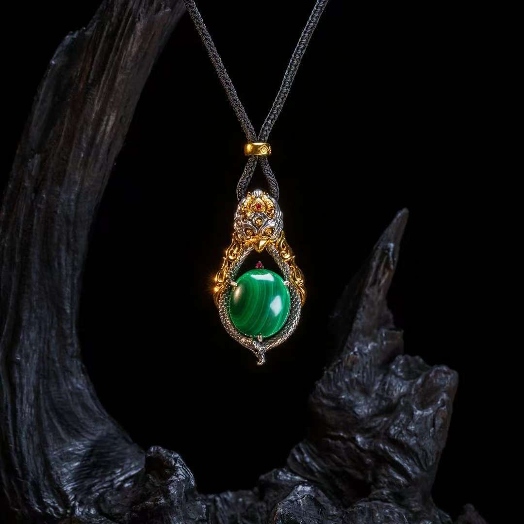 Hand-painted Garuda silver pendant inspired by Tibetan Buddhist jewelry culture, symbolizing power, protection, and spiritual freedom.