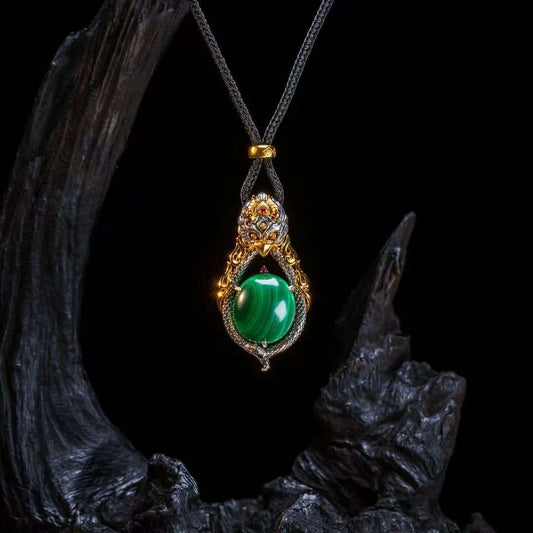 Hand-painted Garuda silver pendant inspired by Tibetan Buddhist jewelry culture, symbolizing power, protection, and spiritual freedom.