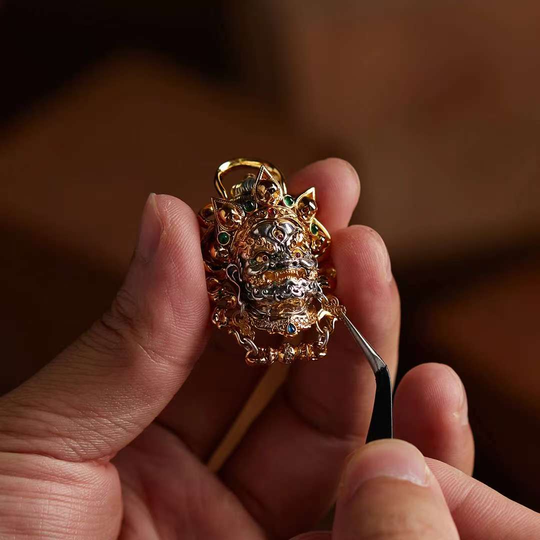 Hand-painted silver Mahakala pendant inspired by Tibetan Buddhist jewelry culture, sacred jewelry art symbolizing protection and power.