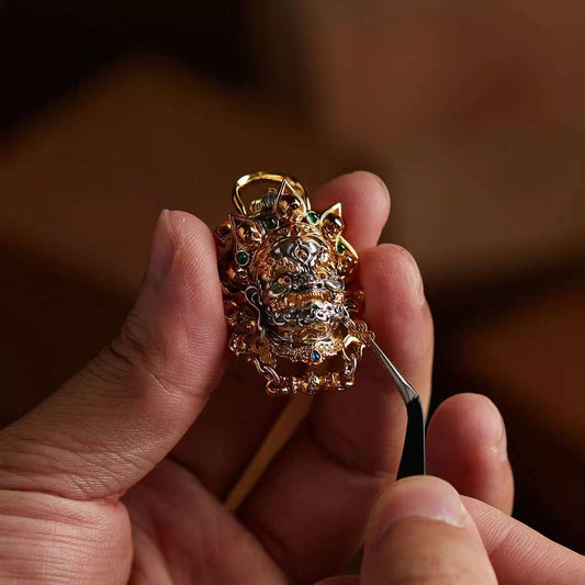 Hand-painted silver Mahakala pendant inspired by Tibetan Buddhist jewelry culture, sacred jewelry art symbolizing protection and power.