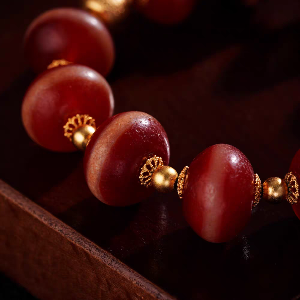 Handmade Tibetan Buddhist red coral Yakshi bead bracelet, showcasing authentic craftsmanship and the rich heritage of Tibetan jewelry culture.