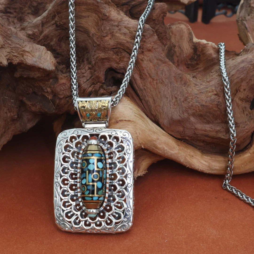 Handcrafted silver nine-eye Taotie square pendant inspired by Tibetan Buddhist jewelry culture, symbolizing protection and fortune.