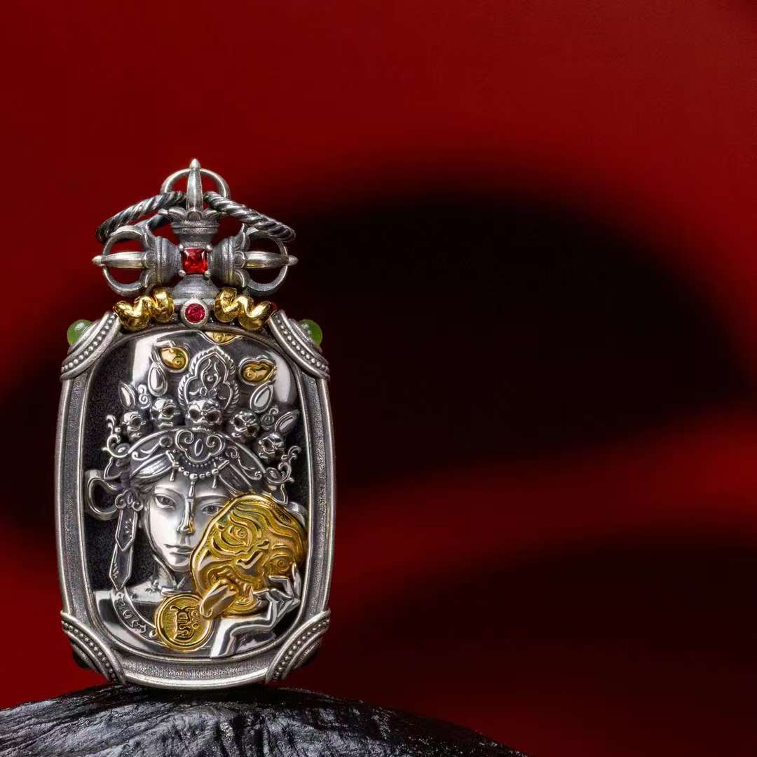 Handmade silver Ten Symbols Buddhist pendant representing Tibetan Buddhist jewelry culture and sacred jewelry art.
