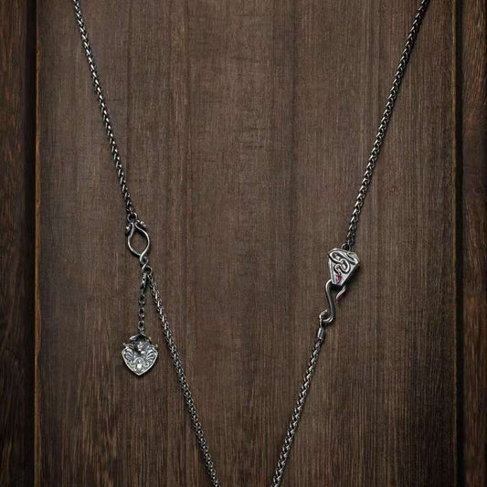 Handmade silver snake king bone necklace from Tibetan Buddhist jewelry culture, stylish and spiritual jewelry art.