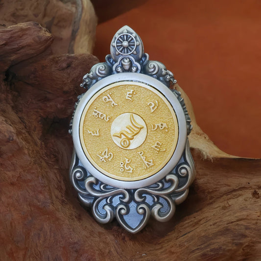 Handmade silver Yellow Jambhala fortune pendant, Tibetan Buddhist jewelry art for prosperity and protection.