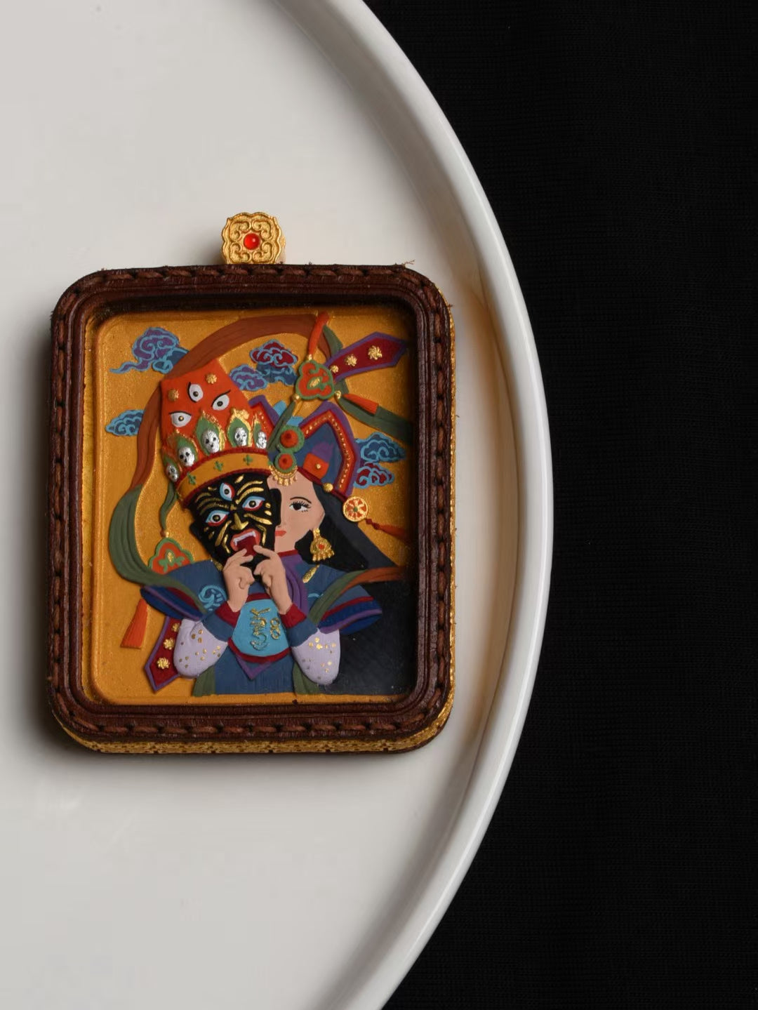 Hand-painted Zaki Lhamo thangka pendant inspired by Tibetan Buddhist jewelry culture, symbolizing wealth protection and spiritual blessings.