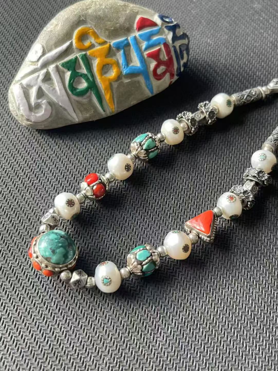showcasing Tibetan Buddhist artistry and multi-treasure elements, ideal for those seeking unique, spiritually enriched jewelry pieces.