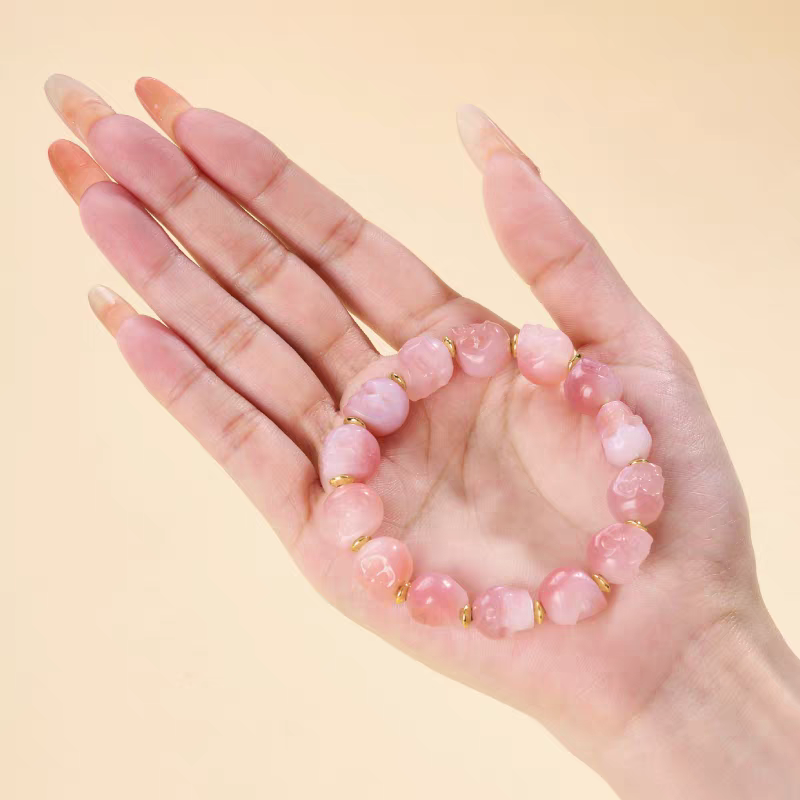 “Tibetan handmade pink Lychee Dzi Beads Peace Bracelet, spiritual beaded jewelry for women, promotes calmness, protection, and luck